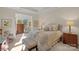 Bright bedroom with a comfortable bed and access to a sunroom at 2205 Lincolnshire Ln, Waxhaw, NC 28173