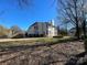 House backyard with grass and trees at 2306 Cota Ct, Charlotte, NC 28262