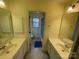 Bright bathroom with double sinks, bathtub, and shower at 2306 Cota Ct, Charlotte, NC 28262