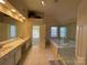 Elegant bathroom featuring a large soaking tub and walk-in shower at 2306 Cota Ct, Charlotte, NC 28262