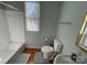 Clean bathroom with a bathtub, toilet, and window at 2306 Cota Ct, Charlotte, NC 28262