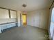 Comfortable bedroom with built-in desk and window at 2306 Cota Ct, Charlotte, NC 28262