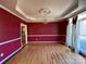 Spacious dining room with hardwood floors, chandelier, and large windows at 2306 Cota Ct, Charlotte, NC 28262