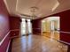 Bright dining room featuring hardwood floors and views into adjacent rooms at 2306 Cota Ct, Charlotte, NC 28262