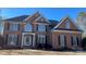 Brick front two-story house with a large yard at 2306 Cota Ct, Charlotte, NC 28262