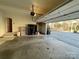 Garage with storage shelving and access to backyard at 2306 Cota Ct, Charlotte, NC 28262