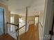 Upstairs hallway overlooking the living room below at 2306 Cota Ct, Charlotte, NC 28262