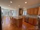 Spacious kitchen with island, granite countertops, and hardwood floors at 2306 Cota Ct, Charlotte, NC 28262