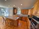 Bright kitchen with island, granite counters, and hardwood floors at 2306 Cota Ct, Charlotte, NC 28262
