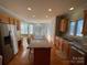Kitchen boasts granite countertops and hardwood floors at 2306 Cota Ct, Charlotte, NC 28262