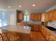 Eat-in kitchen with granite countertops and hardwood floors at 2306 Cota Ct, Charlotte, NC 28262