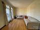 Living room with hardwood floors and large windows at 2306 Cota Ct, Charlotte, NC 28262