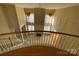 Two story living room with fireplace and balcony overlook at 2306 Cota Ct, Charlotte, NC 28262