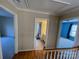 Upper level hallway with bathroom and bedrooms access at 2306 Cota Ct, Charlotte, NC 28262