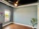 Cozy bedroom with painted cinder block, natural light, and industrial ceiling fixtures at 2338 Yadkin Ave # 505, Charlotte, NC 28205
