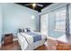 Comfortable bedroom featuring modern lighting, ensuite balcony, and light blue walls at 2338 Yadkin Ave # 505, Charlotte, NC 28205