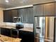 Modern kitchen features stainless steel appliances, granite countertops and dark cabinetry at 2338 Yadkin Ave # 505, Charlotte, NC 28205