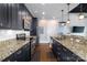 Modern kitchen featuring stainless steel appliances, granite countertops, and dark wood cabinetry at 2338 Yadkin Ave # 505, Charlotte, NC 28205