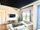 A well-lit living room with cozy seating, a decorative rug, and a view to the outside at 2338 Yadkin Ave # 505, Charlotte, NC 28205