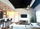 A stylish living room with open floor plan, island seating, and modern ceiling fan at 2338 Yadkin Ave # 505, Charlotte, NC 28205