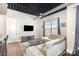 Living room with L-shaped sofa and city views at 2338 Yadkin Ave # 505, Charlotte, NC 28205