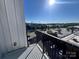 View from the balcony captures cityscape with parking and treelined streets at 2338 Yadkin Ave # 505, Charlotte, NC 28205