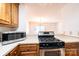 Kitchen with stainless steel gas range and microwave at 2433 1St Nw St # 23, Hickory, NC 28601