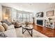 Bright living room with fireplace, hardwood floors, and ample natural light at 509 N Graham St # 2D, Charlotte, NC 28202