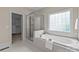 Elegant bathroom with soaking tub, walk-in shower, and double vanity at 5422 Glen Forest Dr, Charlotte, NC 28226