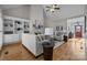 Spacious living room with hardwood floors, built-in shelves, and fireplace at 5422 Glen Forest Dr, Charlotte, NC 28226