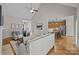 Bright living room with hardwood floors, vaulted ceilings and kitchen view at 5422 Glen Forest Dr, Charlotte, NC 28226