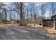 Spacious backyard with a patio and mature trees at 605 Impala Dr, Albemarle, NC 28001