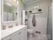 Clean bathroom with white vanity and beadboard wainscoting at 605 Impala Dr, Albemarle, NC 28001