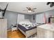 Bright bedroom with a queen-size bed and wood floors at 605 Impala Dr, Albemarle, NC 28001