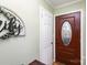 Front entry with wood door and glass accents at 605 Impala Dr, Albemarle, NC 28001