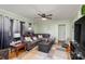 Spacious living room with sectional sofa and large TV at 605 Impala Dr, Albemarle, NC 28001