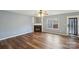 Living room with hardwood floors and a fireplace at 6345 Cora St, Charlotte, NC 28216