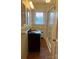 Bathroom featuring a glass enclosed shower, vanity with a black countertop, and natural light from the window at 936 N 5Th St, Albemarle, NC 28001