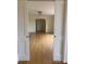 Living room featuring hardwood floors, neutral walls, chandelier and large doorway at 936 N 5Th St, Albemarle, NC 28001