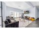 Spacious basement recreation area with comfortable seating at 1009 Murandy Ln, Matthews, NC 28104