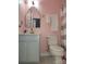 Cozy bathroom with pink walls, an ornate mirror, and a shower with a decorative curtain at 1009 Murandy Ln, Matthews, NC 28104