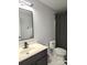 This bathroom features a modern vanity with black fixtures and a patterned shower curtain at 1009 Murandy Ln, Matthews, NC 28104