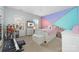 Bright bedroom with pink and teal accent wall, a full-size bed, and plenty of storage at 1009 Murandy Ln, Matthews, NC 28104