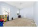 Small bedroom with a single window and ample floor space at 1009 Murandy Ln, Matthews, NC 28104