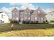 Brick two-story house with landscaping and a front yard at 1009 Murandy Ln, Matthews, NC 28104