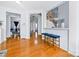 Bright hallway with hardwood floors and a view into the living areas at 1009 Murandy Ln, Matthews, NC 28104