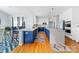 Stunning kitchen with a double island, blue cabinetry, and white countertops at 1009 Murandy Ln, Matthews, NC 28104