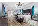 Large main bedroom with a king-size bed, built in daybed and barn door leading to the en-suite bathroom at 1009 Murandy Ln, Matthews, NC 28104