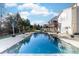 Expansive inground pool with stone accents and a waterfall feature at 1009 Murandy Ln, Matthews, NC 28104