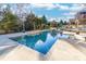 Large rectangular pool with stonework and surrounding landscaping at 1009 Murandy Ln, Matthews, NC 28104